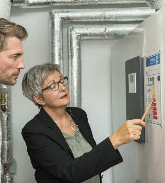 Energy efficiency experts reviewing a heating system energy rating